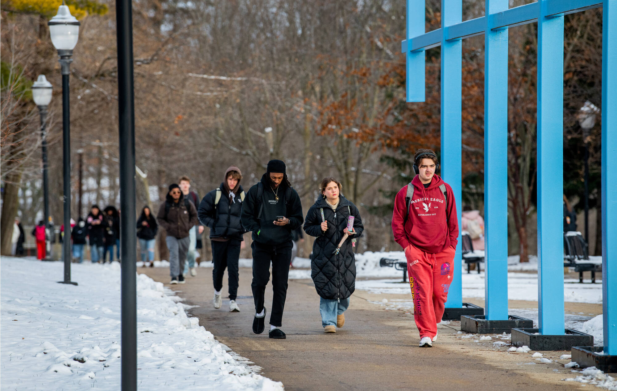 Students walk through the Great Lakes Plaza on their way to classes during the first day of the winter semester January 12.